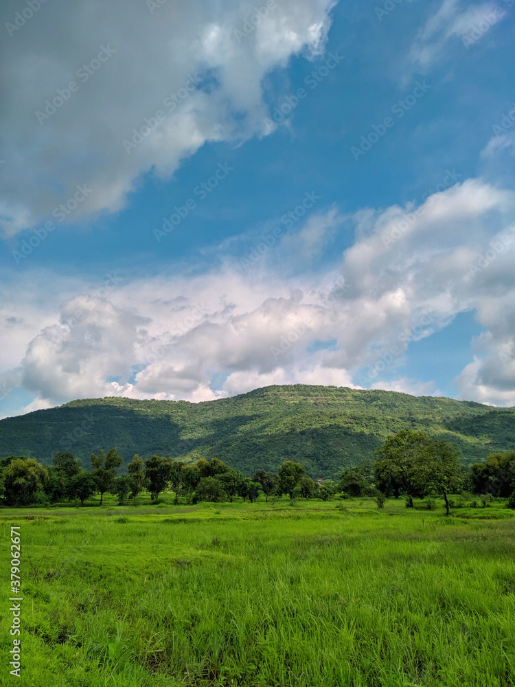 clouds over the mountains of kokan. Beautiful Landscape in maharashtra with greenery of monsoon.