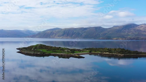aerial view of balnagowan island and loch linnhe near fort william and ben nevis during a calm clear blue day in autumn in the argyll region of the highlands of scotland