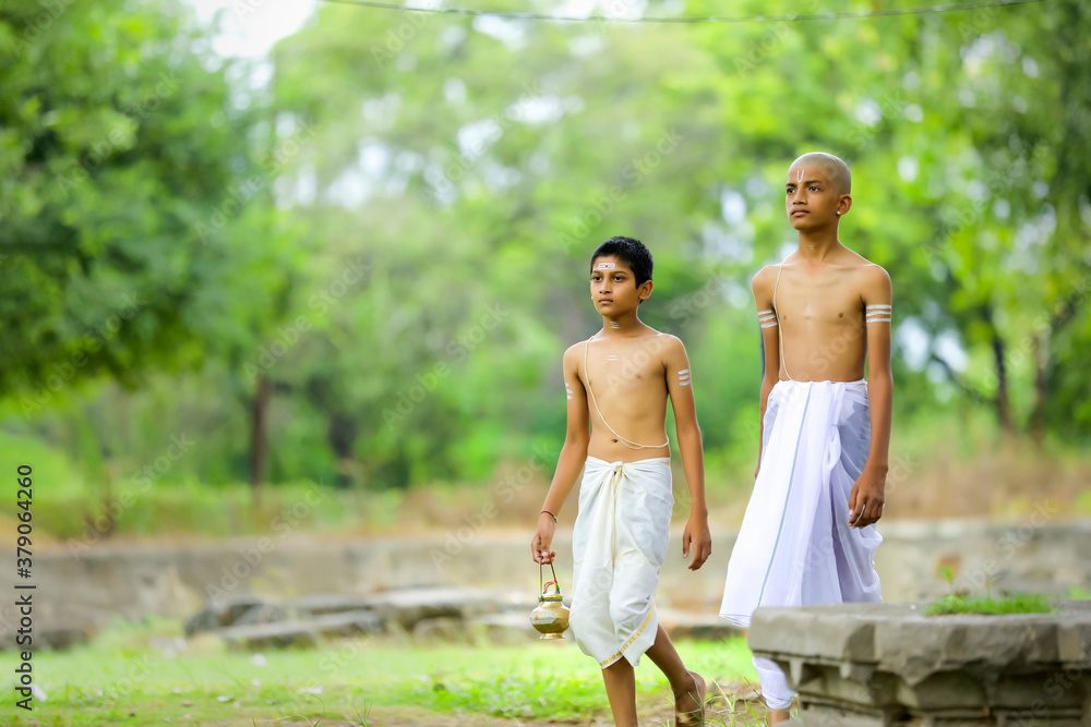 Fototapeta premium a priest child walking at forest