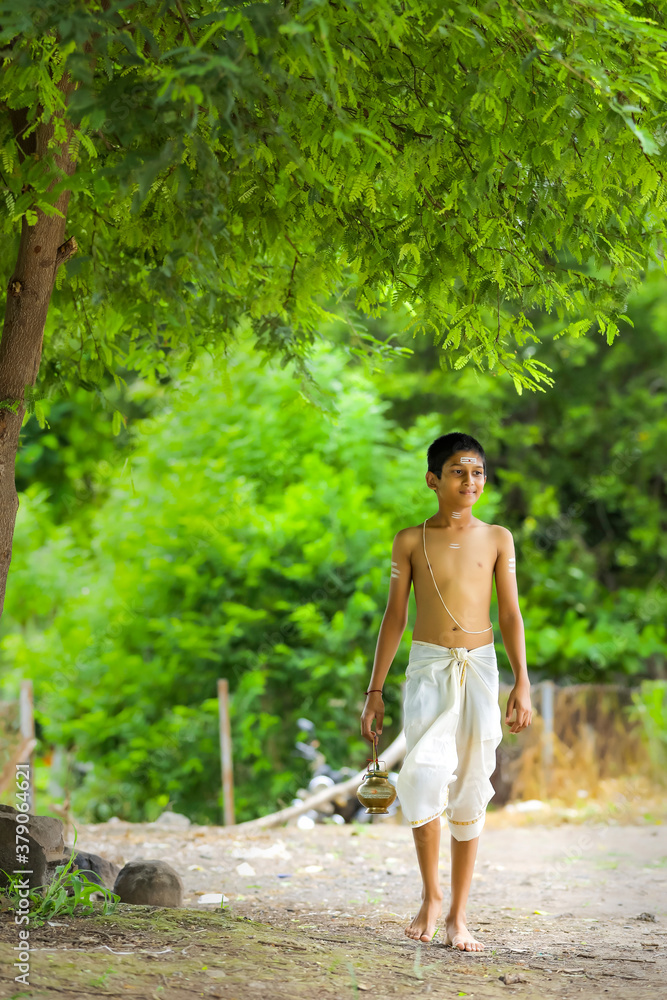 a priest child walking at forest a priest child walking at forest