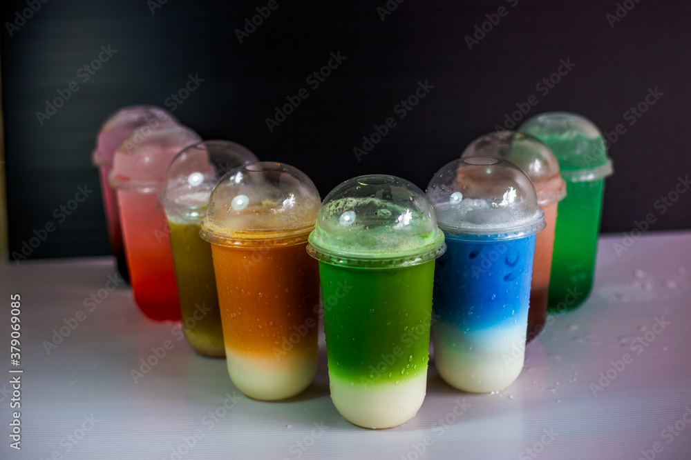 A close-up view of the drinks put into the cup, (iced tea, cocoa, chocolate) with pearls, is a popular menu in cafes and restaurants. A close-up view of the drinks put into the cup, (iced tea, cocoa, chocolate) with pearls, is a popular menu in cafes and restaurants.