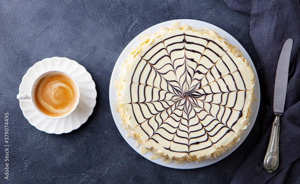 Traditional Hungarian Esterhazy cake, torte with cup of coffee. Grey background. Top view.