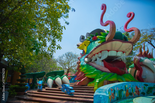 A big statue dragon at Suoi Tien park in Ho Chi Minh Vietnam wide shot photo