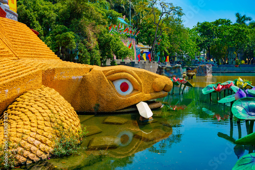 A statue turtle at Suoi Tien park in Ho Chi Minh Vietnam photo