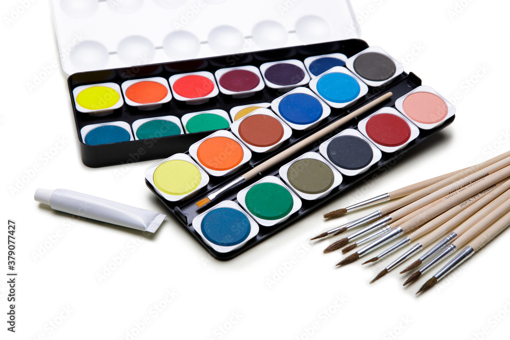 Watercolor paints box with paint brush on white background Watercolor paints box with paint brush on white background