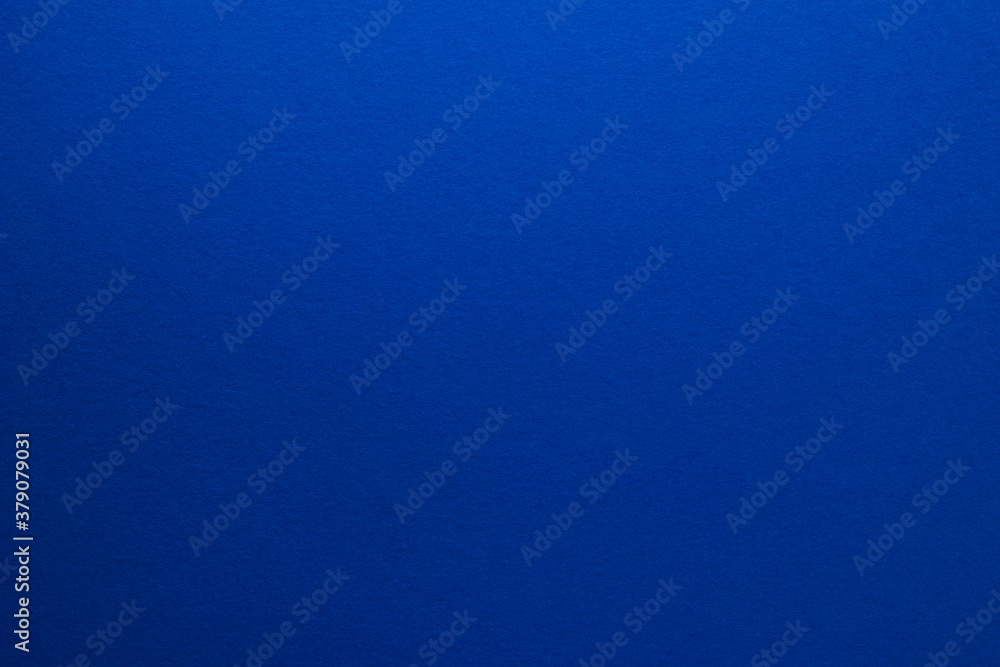 Blue background. Sheet of blank blue paper with texture, close up. Blue background. Sheet of blank blue paper with texture, close up.