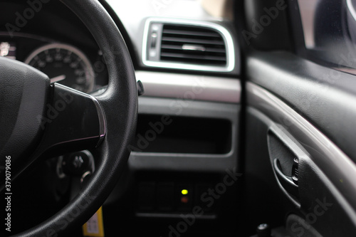 Steering wheel right side. The past of steering wheel. Automotive Interior, Steering Wheel Close up. © Muanpare