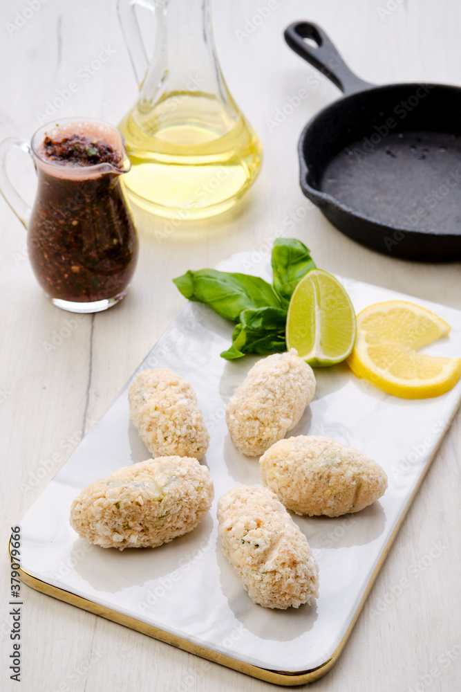 Top view of brown salmon cutlet in cheese breading Top view of brown salmon cutlet in cheese breading