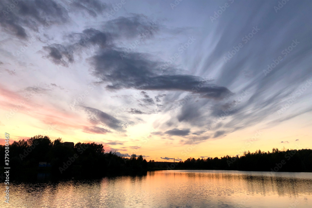 cloudy sky at sunset over the lake cloudy sky at sunset over the lake