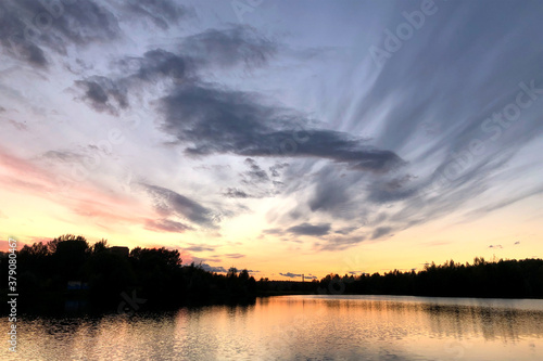 cloudy sky at sunset over the lake