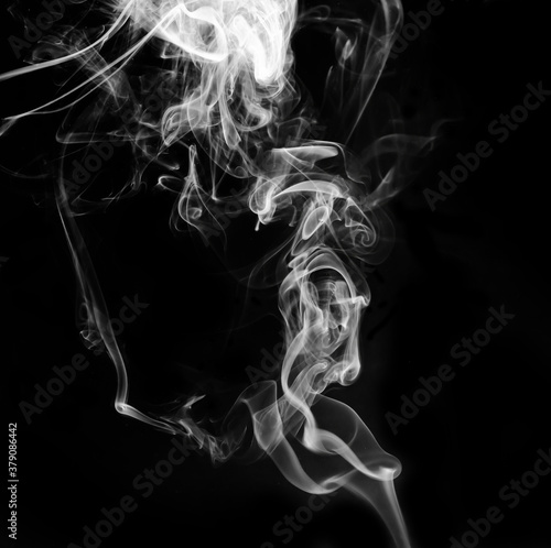 abstract fragment movement of white smoke on black background.