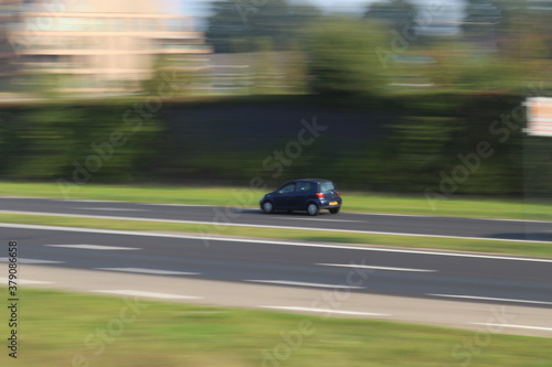 car panning on highway. © Weekly