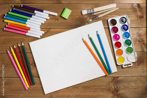 Foto Assortment of stationery for drawing on wood background