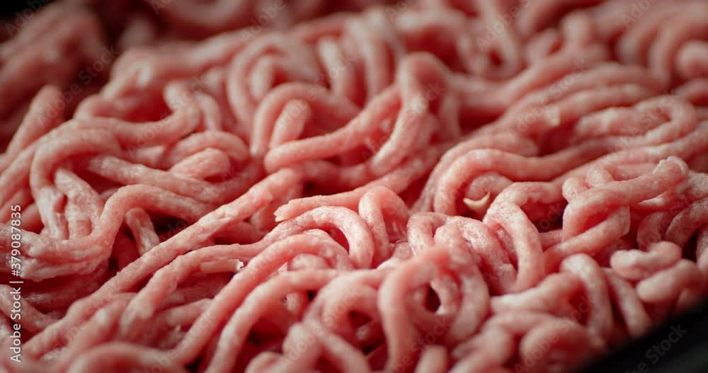 Fresh raw minced meat slowly rotates. Fresh raw minced meat slowly rotates.