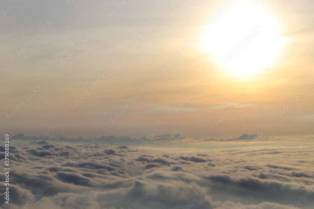 Morning photos nature of the clouds in the sky gathered like an ocean wave,with a huge sun shining on the top.The weather was cold and comfortable.So beautiful.Take photo on the top of the mountain. Morning photos nature of the clouds in the sky gathered like an ocean wave,with a huge sun shining on the top.The weather was cold and comfortable.So beautiful.Take photo on the top of the mountain.