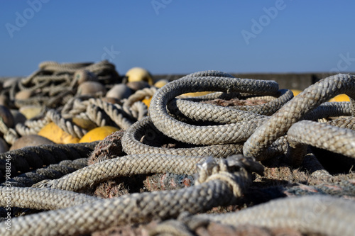 fisherman's ropes piled up in the small port of Camogli in Liguria