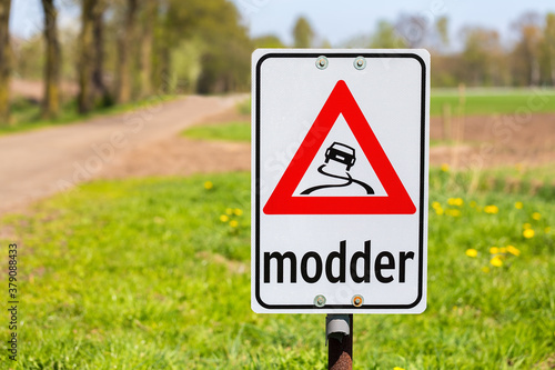 Traffic sign with text Modder or Mud along road