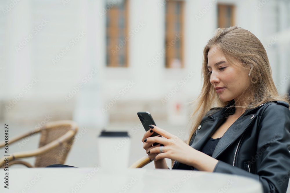 businesswoman texting on mobile phone businesswoman texting on mobile phone