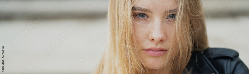young female model blonde Caucasian appearance, posing for the camera open face, straight hair. panoramic photo for the company on the banner young female model blonde Caucasian appearance, posing for the camera open face, straight hair. panoramic photo for the company on the banner