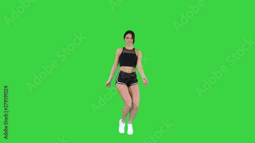 Sexy dancing young sporty woman on a Green Screen, Chroma Key.