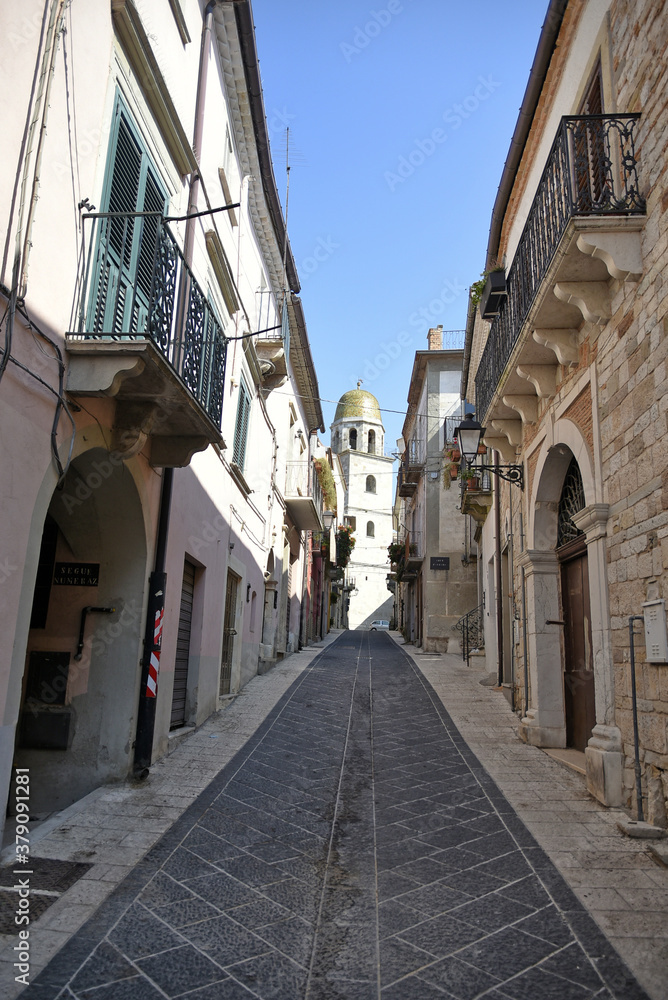 A narrow street among the old houses of San Bartolomeo in Galdo, a small town in the province of Benevento, Italy.
A narrow street among the old houses of San Bartolomeo in Galdo, a small town in the province of Benevento, Italy.