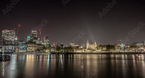 View of the Tower of London at night with bright lights
