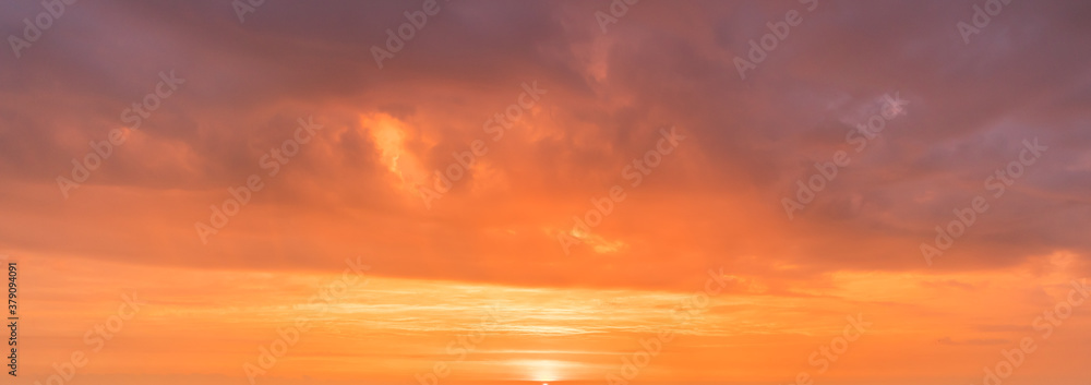 Romantic sunrise at a cloudy sky