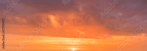 Fototapeta Naklejka Na Ścianę i Meble -  Romantic sunrise at a cloudy sky