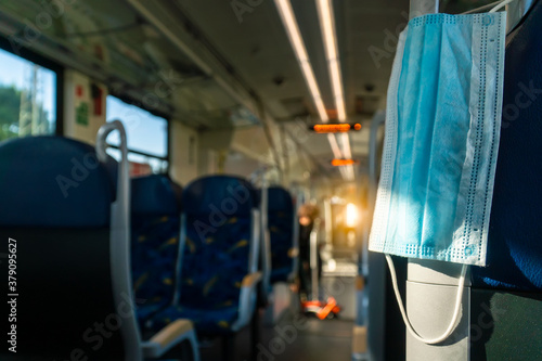 Empty inside train bus subway public transport with window view and blue seats people tourist new normal social distancing safe travel with hygiene face mask protect from covid corona virus