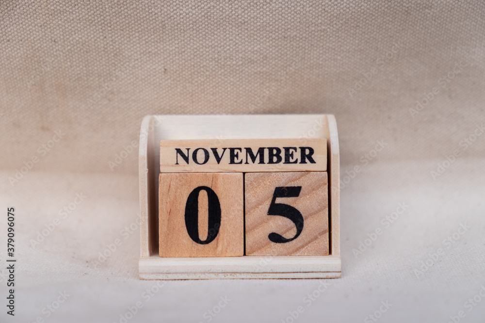 November 5th. Image of November 5 wooden color calendar on white canvas background. empty space for text November 5th. Image of November 5 wooden color calendar on white canvas background. empty space for text