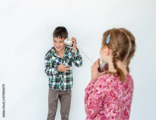 Children playing with self made telephone