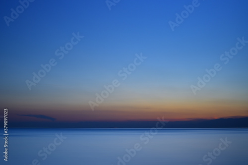 sunset at the sea  clouds and colors reflected in all their shades