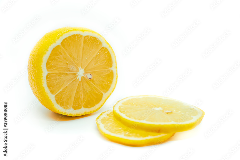 Sliced yellow lemon isolated on a white background. Fresh juicy lemon. Sliced yellow lemon isolated on a white background. Fresh juicy lemon.