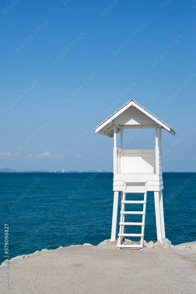 White lifeguard tower by the sea