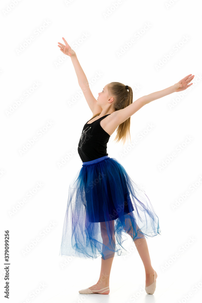 Teenage Girl Gymnast Standing on Tiptoe and Looking to the Side. Teenage Girl Gymnast Standing on Tiptoe and Looking to the Side.