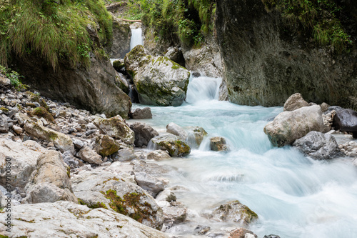 Beautiful stream of water running through rocks and stones