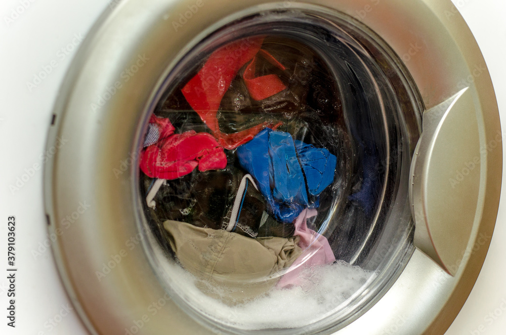 clothes in the washing machine clothes in the washing machine