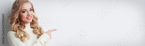 Girl pointing to empty copy space