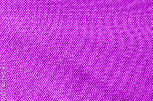 Fabric knitting wool texture purple color. Cloth knitted wool surface.