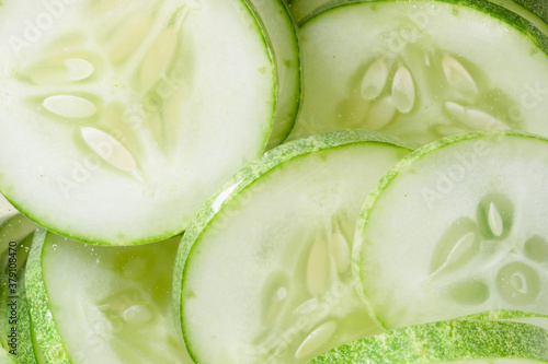 Pile of green cucomber slices, close up photo