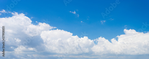 Fototapeta Naklejka Na Ścianę i Meble -  Puffy white clouds against blue sky background
