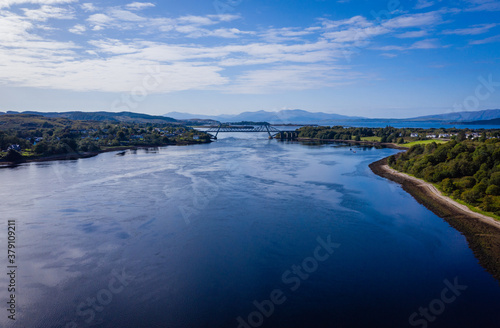 aerial view of the falls of lora near connel, connel bridge and oban in the argyll region of the highlands of scotland during a clear blue autumn day