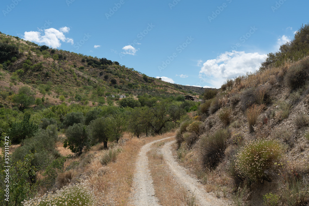 dirt road between the mountains in southern Spain