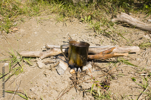 cooking coffee on fire in steel cup