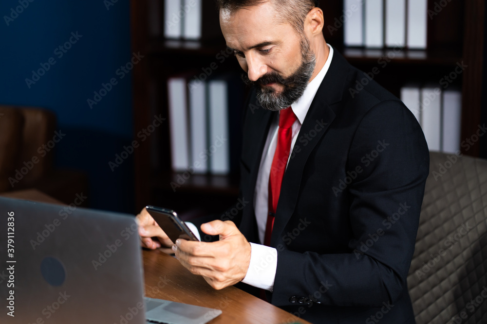 Authentic A bearded businessman is discussing business on the facetime in business negotiations. Video Call. Face time and Conference call concept Authentic A bearded businessman is discussing business on the facetime in business negotiations. Video Call. Face time and Conference call concept