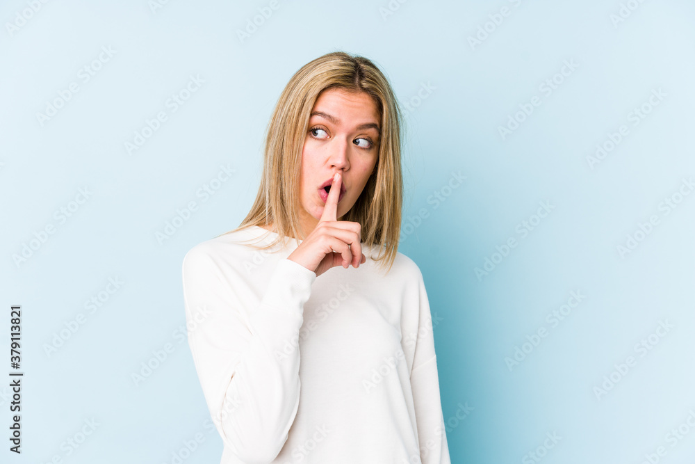 Young blonde caucasian woman isolated keeping a secret or asking for silence. Young blonde caucasian woman isolated keeping a secret or asking for silence.