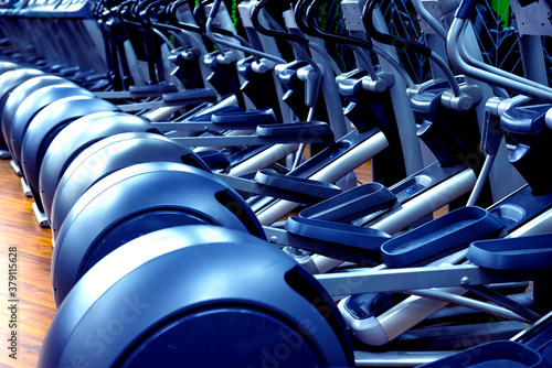 Modern gym interior with new cardio equipment.