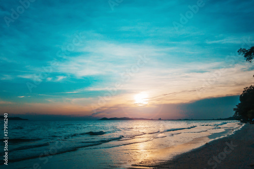 Blue Twilight Sky Sunset on The Beach Background. © aekkorn