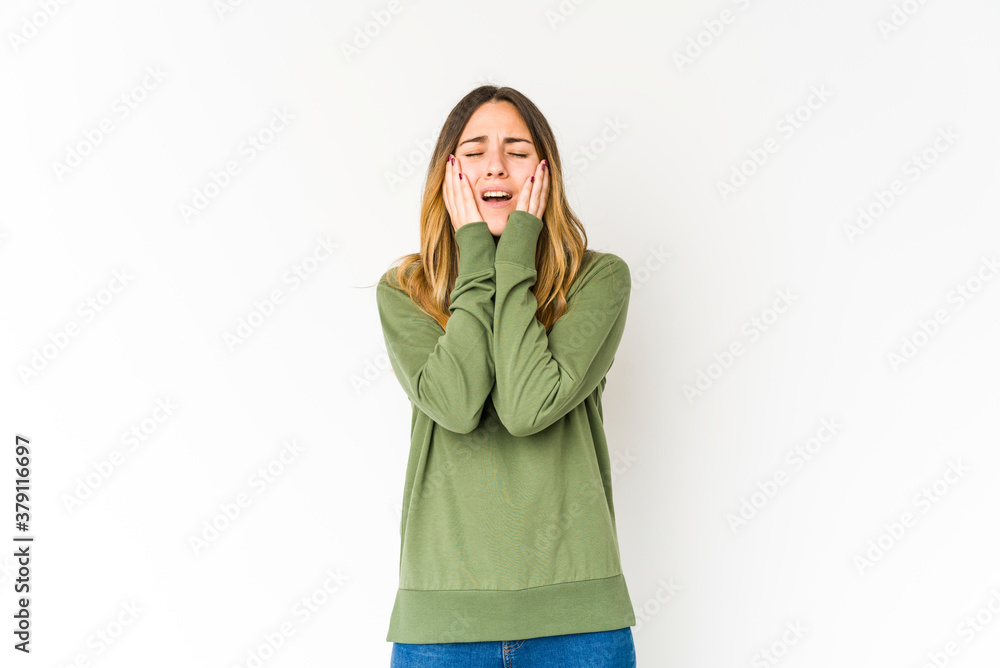 Young caucasian woman isolated on white background whining and crying disconsolately. Young caucasian woman isolated on white background whining and crying disconsolately.