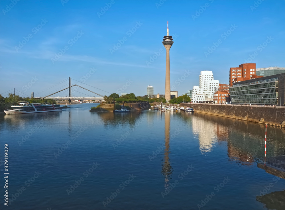 Television tower at the Media harbor in duesseldorf with facades and blue sky